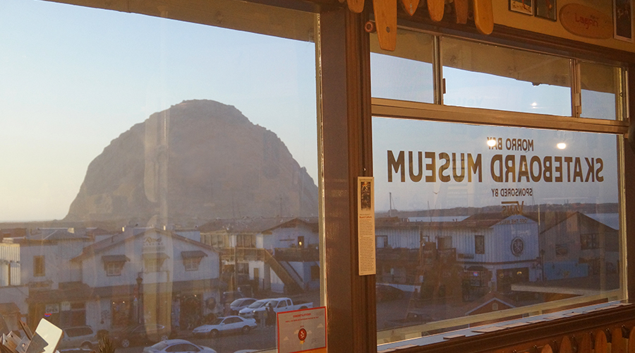 morro rock from the window of morro bay skateboard museum