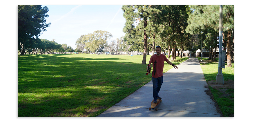 longboarder on the alondra park path