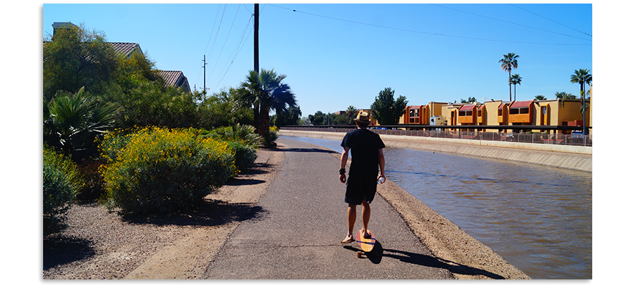 cruising the path on a longboard