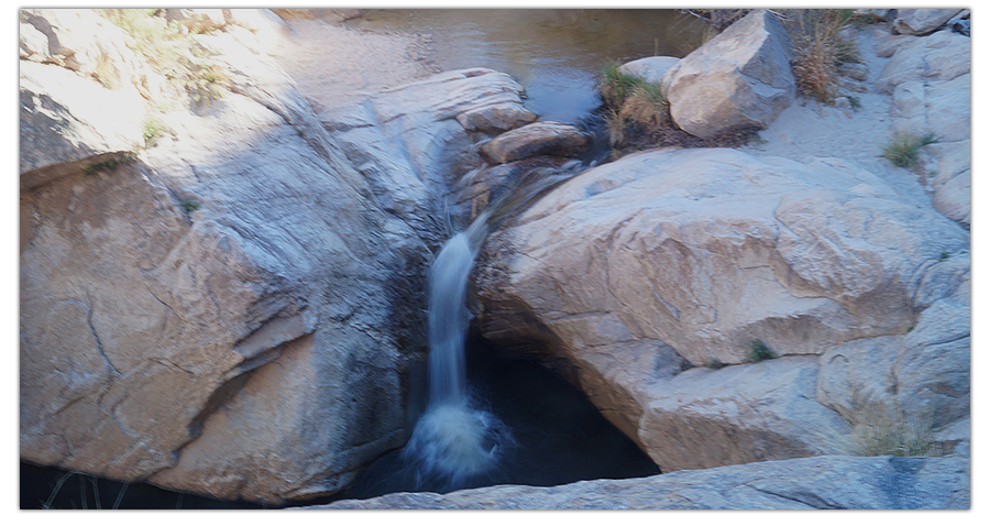 small waterfall between the romero pools