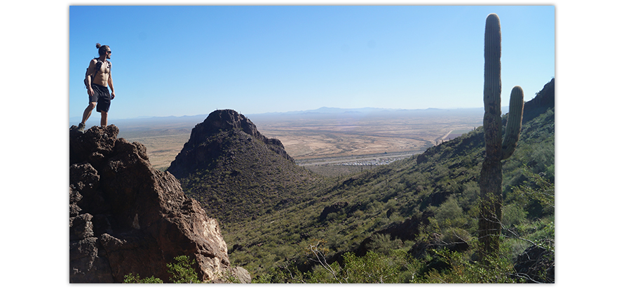 climbing a rock while hiking picacho peak