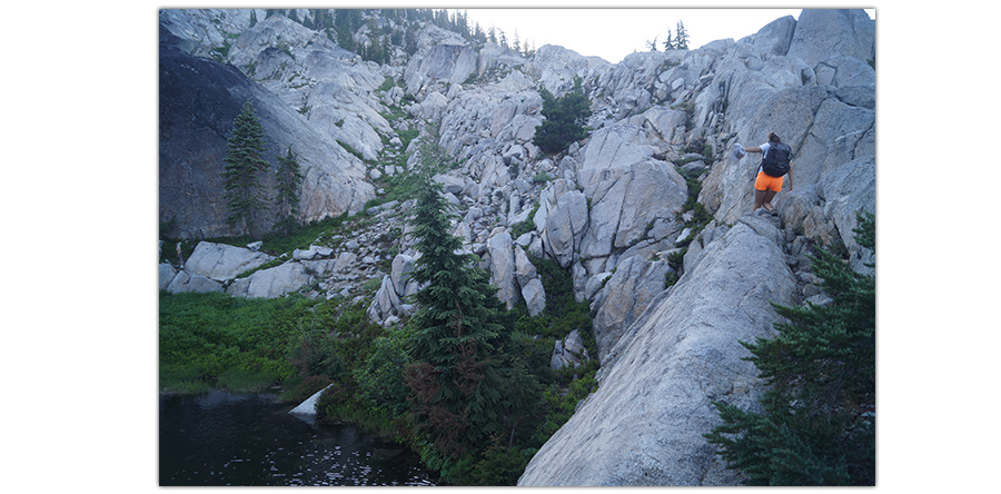 climbing the granite boulders on the hike to paynes and albert lakes