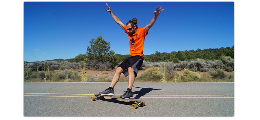 longboarder doing a power slide