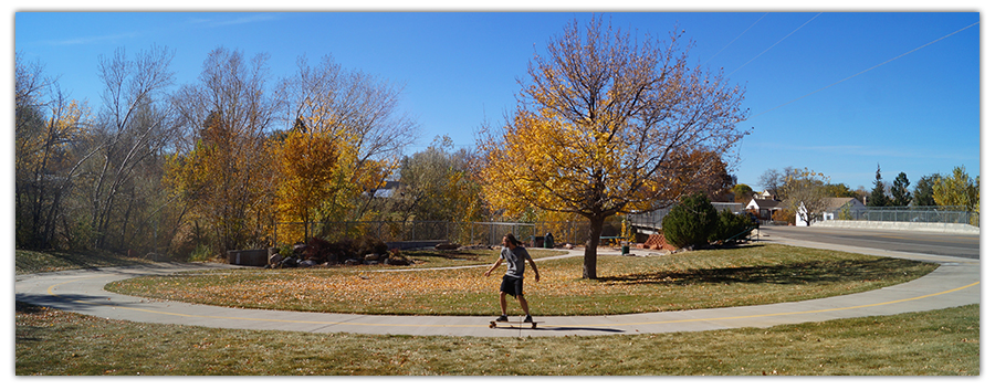 guy longboarding on coal creek trail