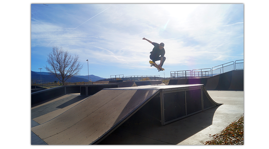 skater doing cool trick at the skate park