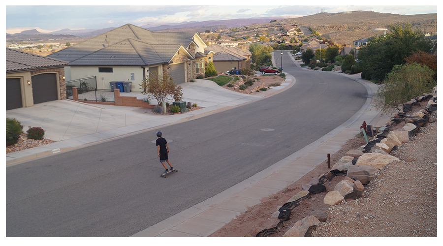 smooth downhill longboarding in a saint george neighborhood