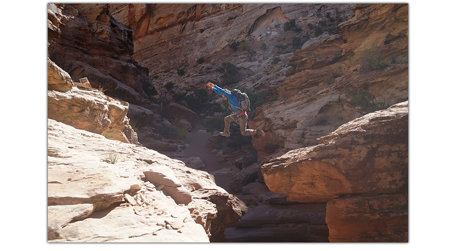 shane jumping from rock to rock in ding and dang canyons