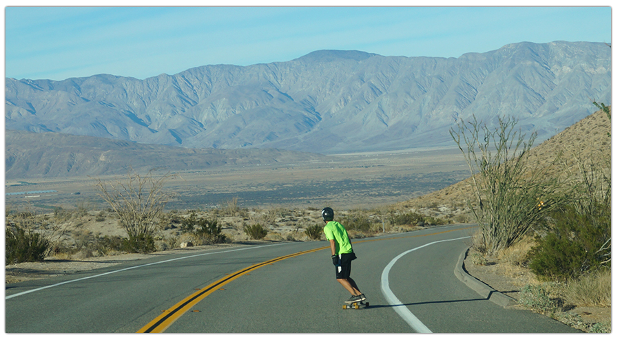 longboarding on a scenic desert road