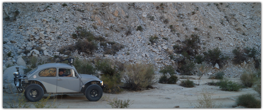 A buggy driving in a wash 