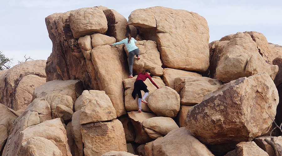 scrambling up a pile of boulders