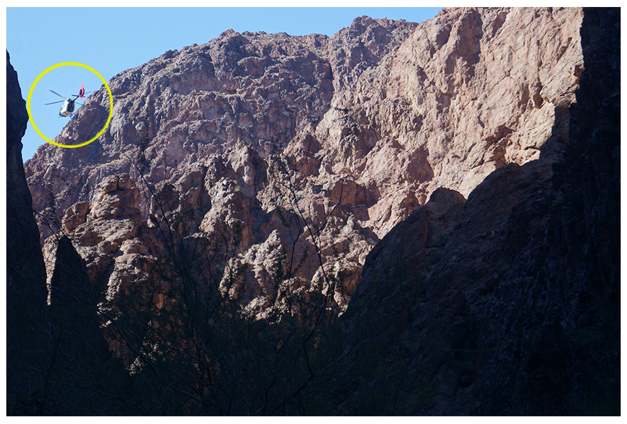 helpicopter flying through the canyon