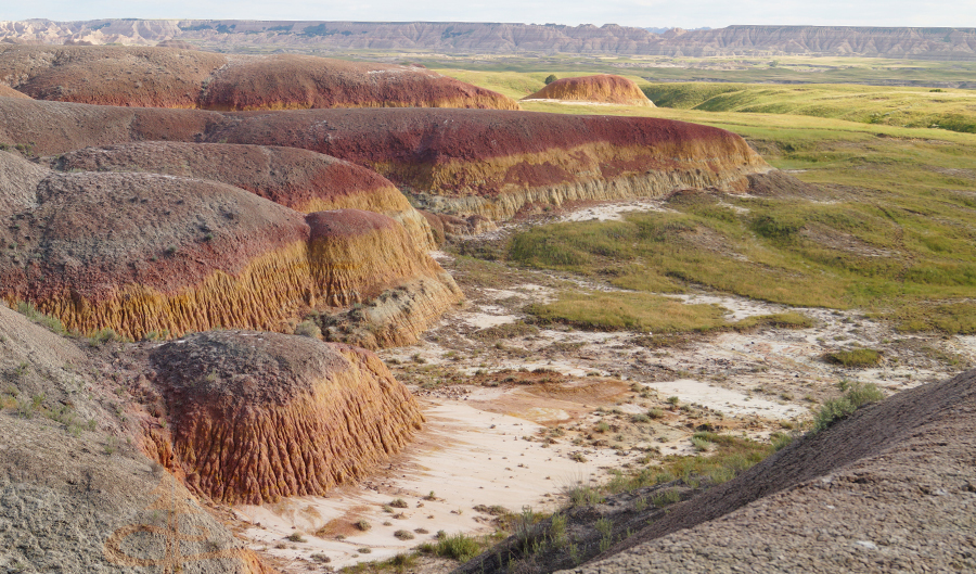 colorful sediment mountains on the floor of badlands national park