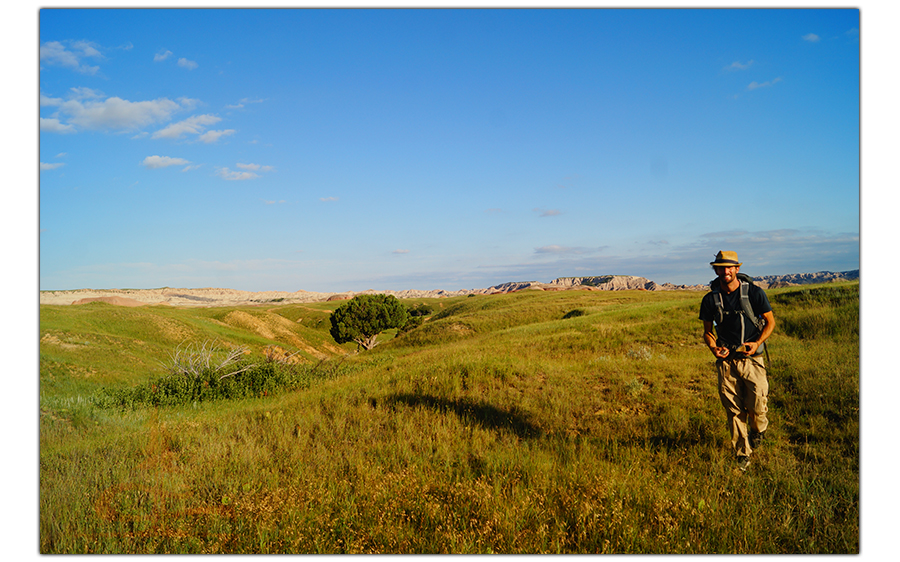 hiker in the mixed grass prairie