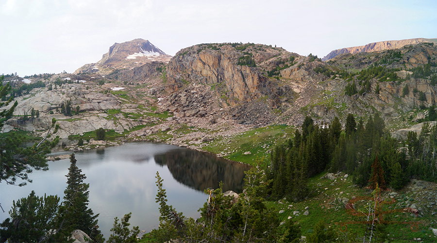 dramatic granite beartooth mountains bordering lake