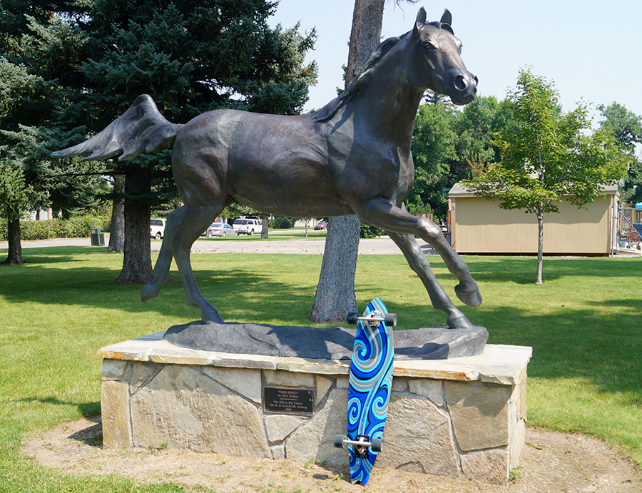horse sculpture and longboard at the lions community park where the big timber farmers market is held