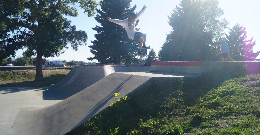 skateboarder getting air at the bozeman skatepark