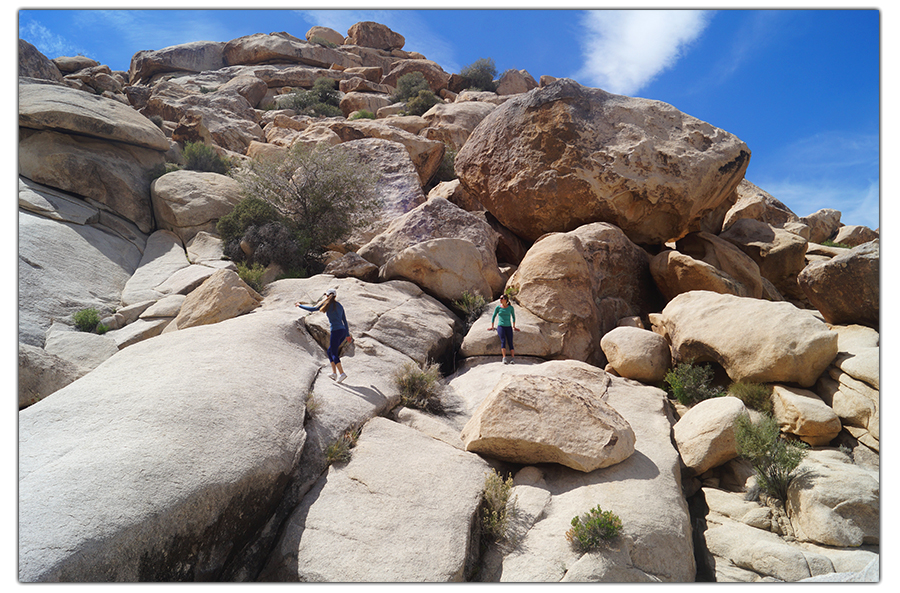 climbing up the stacked boulders