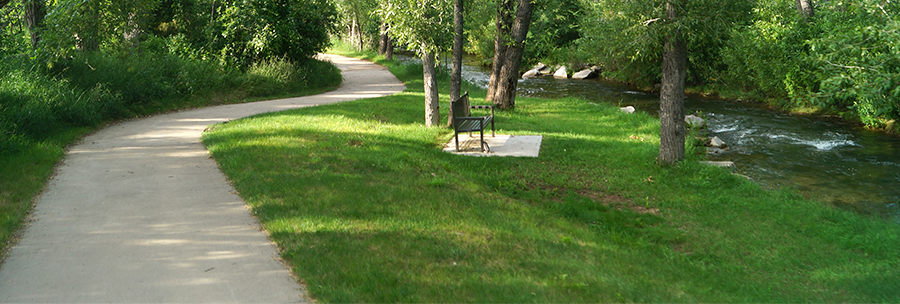 path and bench by creek on spearfish bike path