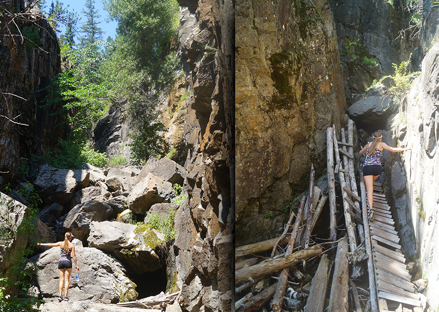 hiking on boulders and wooden ladders in a canyon