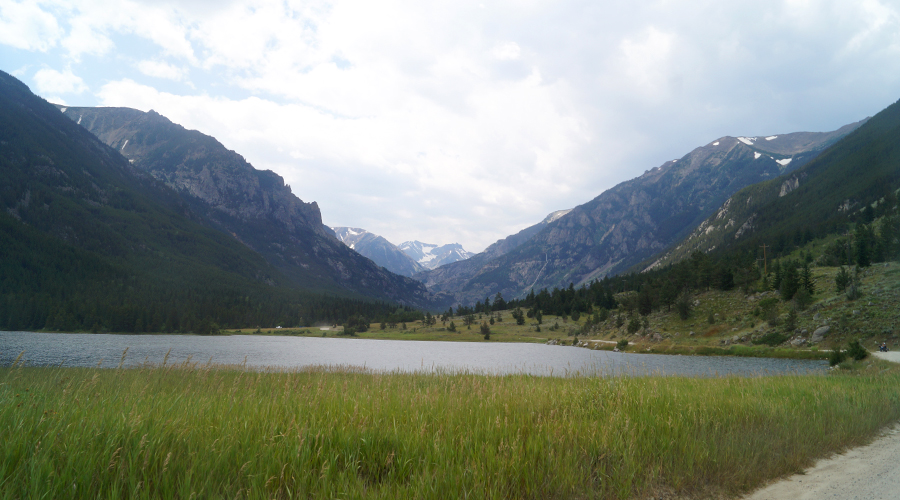 lake in front of mountain canyon
