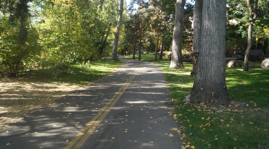 shaded paved section of boise river greenbelt