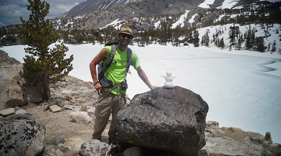 making a snowman on little lakes valley trail