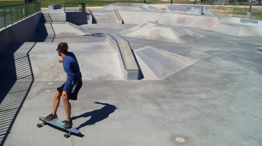 cruising on a longboard at the skatepark in Ridgecrest