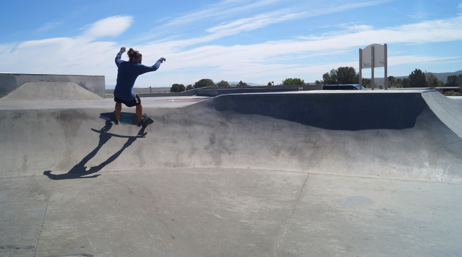 hitting the banked turn on a longboard