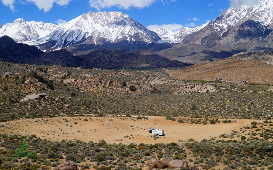 camping at the buttermilks with a snowy mountain backdrop