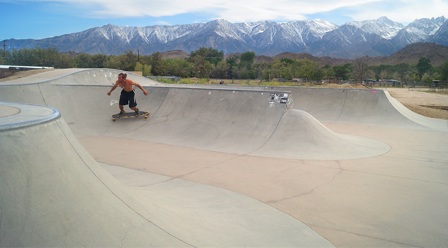 longboarding at the lone pine skatepark with gorgeous mountain backdrop