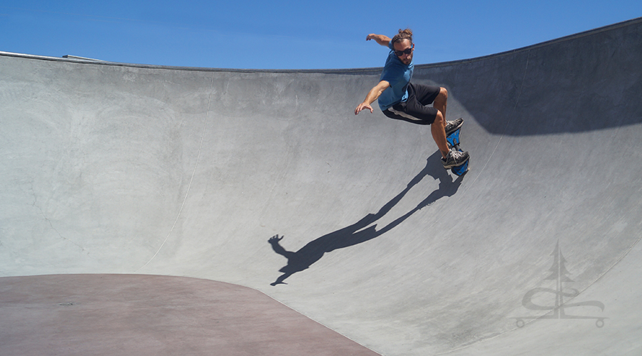 surfing the cement on a rip stick