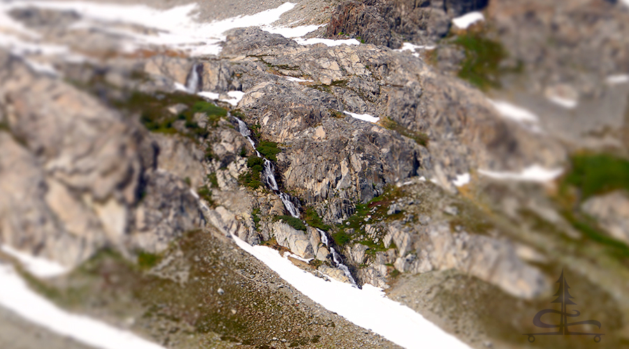 long waterfall running down the mountainside