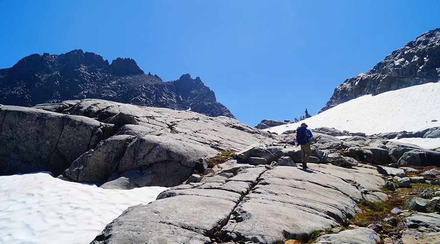 climbing the granite up through the snow