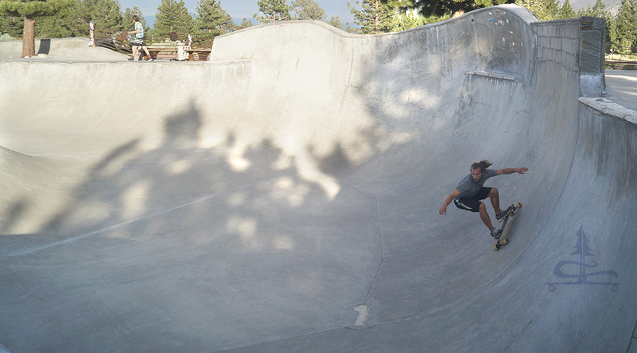 cruising the mammoth skatepark on a longboard