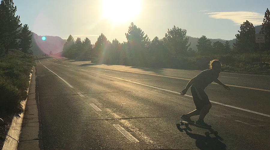 cruising downhill towards the mammoth skatepark