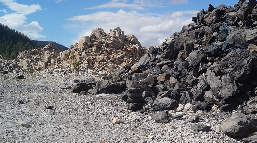 piles of both brown and black obsidian rocks