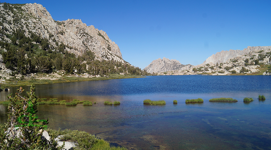 snow lake surrounded by granite