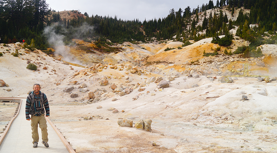 walking across the boardwalk at bumpass hell volcanic feature