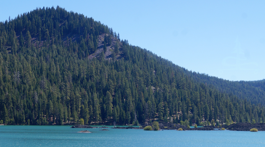 reaching the shore of butte lake while backpacking lassen volcanic national park