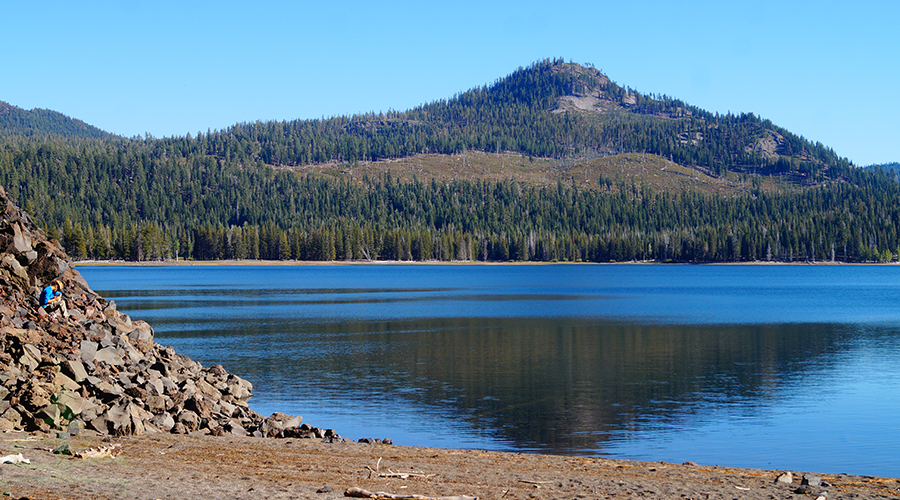 lava rocks sprawling to the shoreline of snag lake