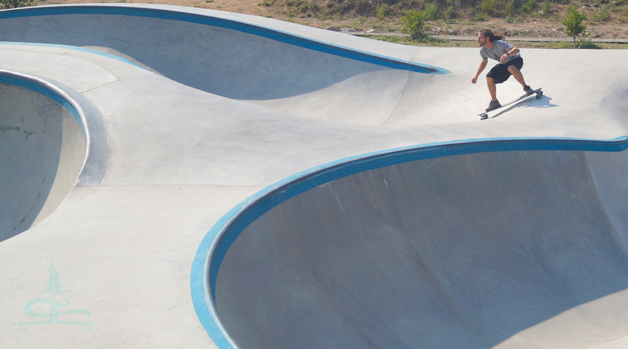 getting speed while longboarding the Frisco Skatepark