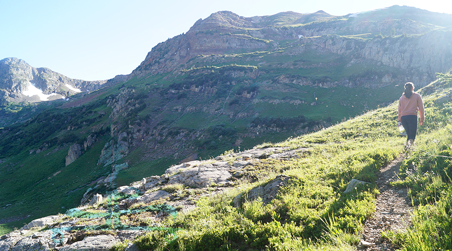 following the trail up the mountainside to the saddle 