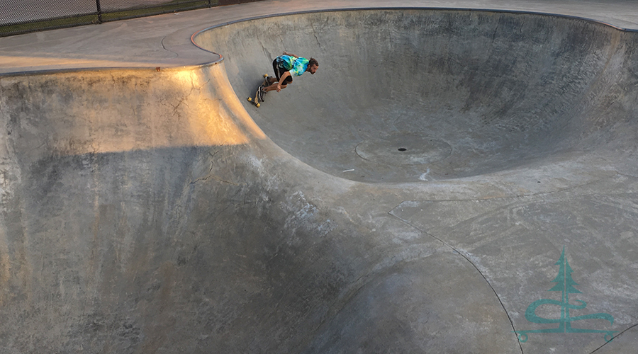 cruising the bowl on a longboard