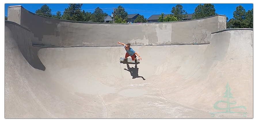 longboarding the banked turns at the basin skatepark in flagstaff