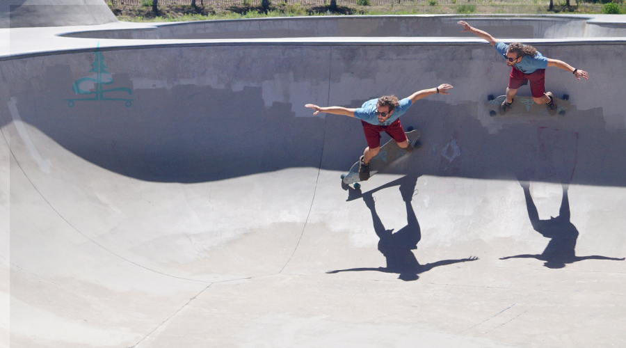 cruising the bowls on a longboard