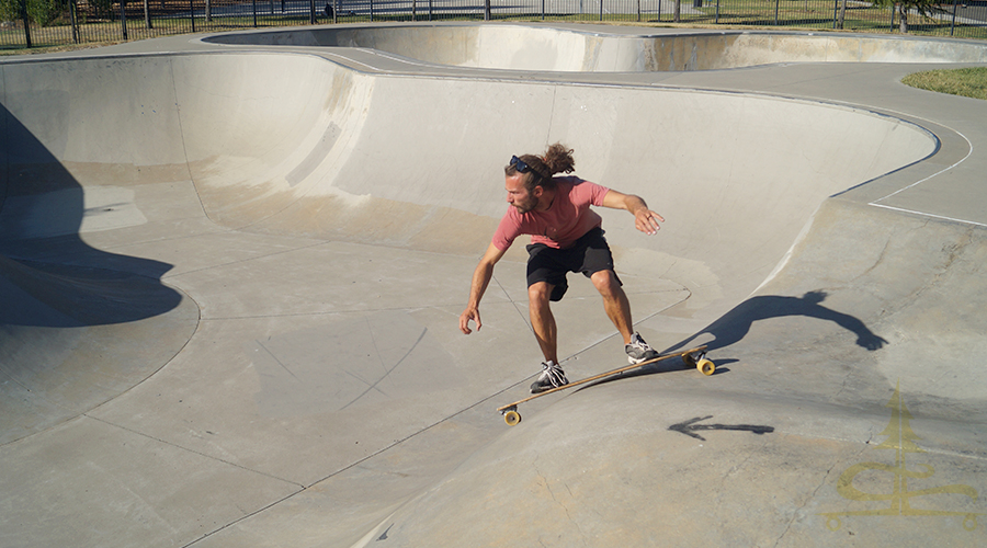 rolling in to the bowl on a longboard