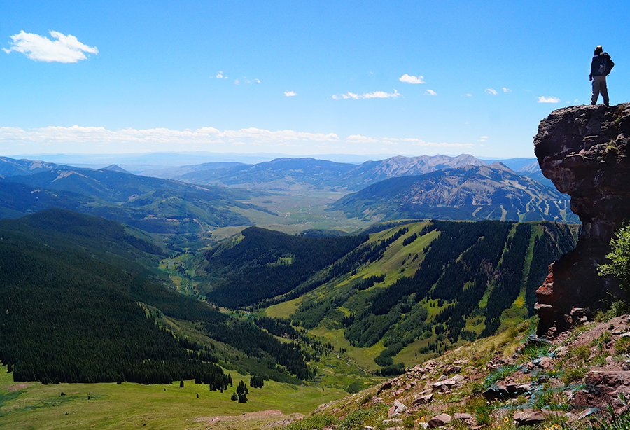 stunning view overlooking the lush green valley and surrounding mountains below