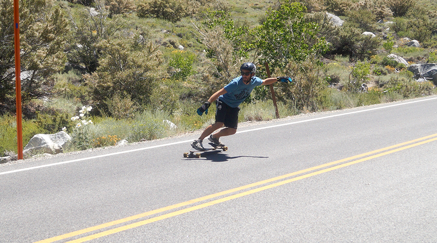 pumping on a flexible carving longboard