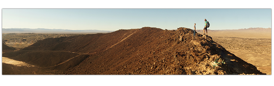 standing on the narrow rim of amboy crater