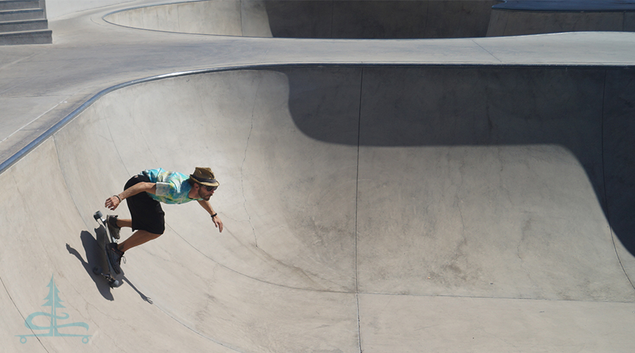 cruising the bowl on a longboard